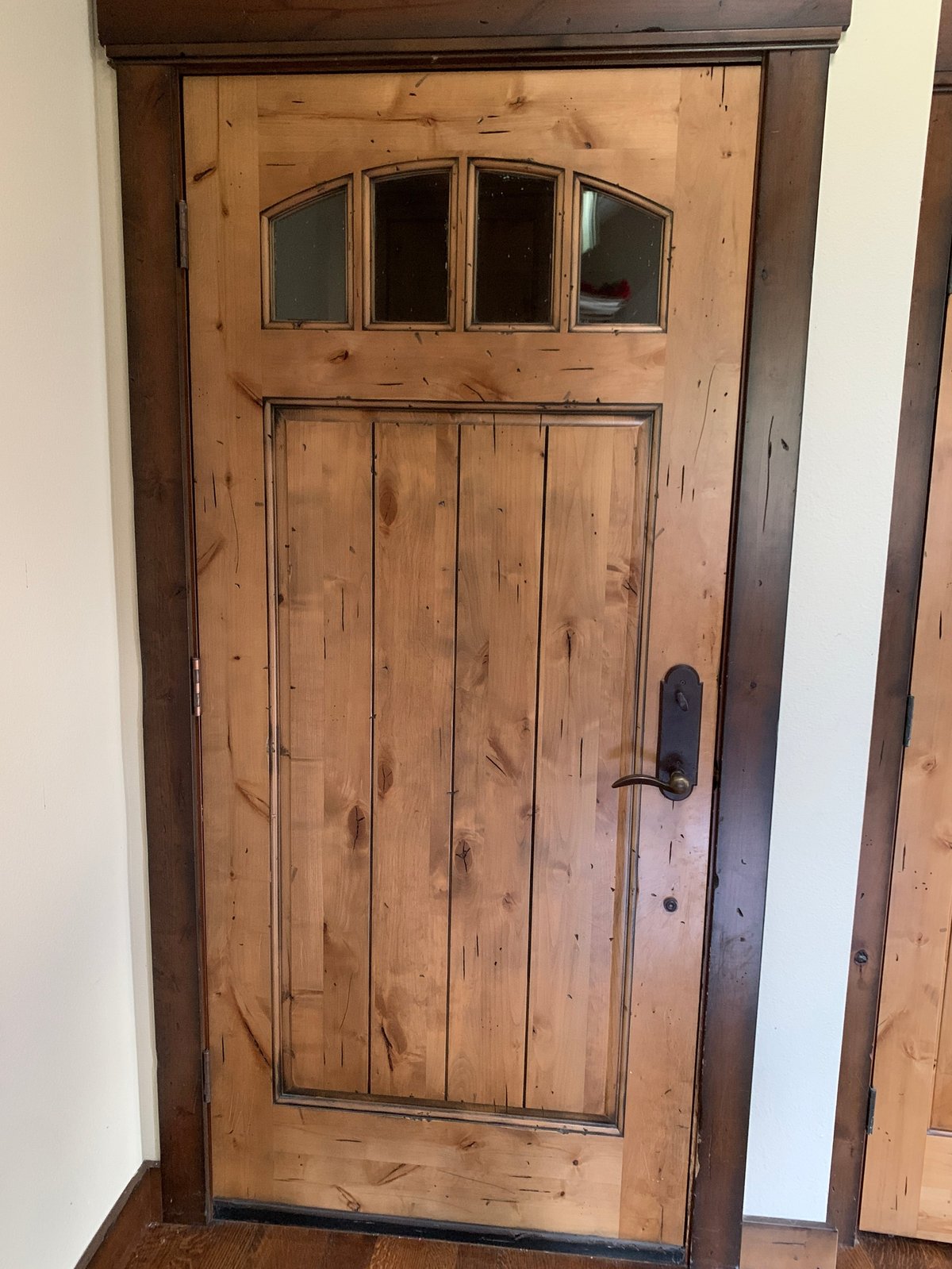 Solid wood door showing the handle